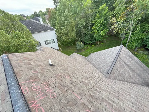 An aerial view of a roof with shingles.