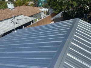 The roof of a house with a metal roof.